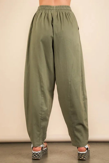 Back view of boho woven pants for women in olive green, featuring a relaxed fit and elastic waistband