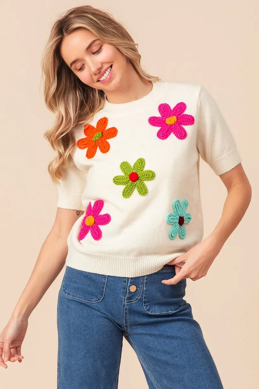 Trendsi crochet flower sweater top featuring colorful floral appliques for a vibrant spring look