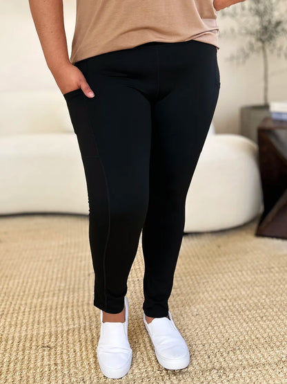 Trendsi wide waistband sports leggings in black with side pockets for comfort and style