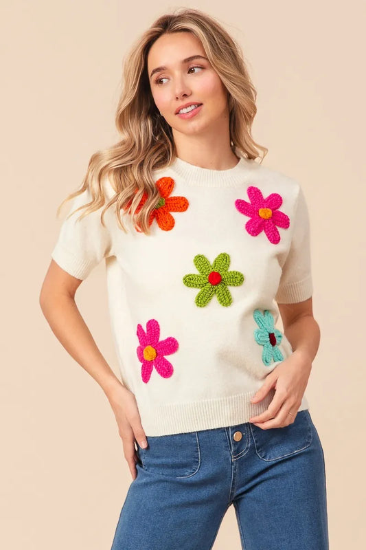 Trendsi Crochet Flower Sweater Top with Colorful Floral Patterns on a Cream Background