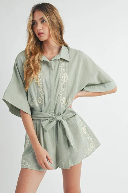 Trendsi embroidered button down romper in soft green with floral embroidery and tie waist for a stylish look