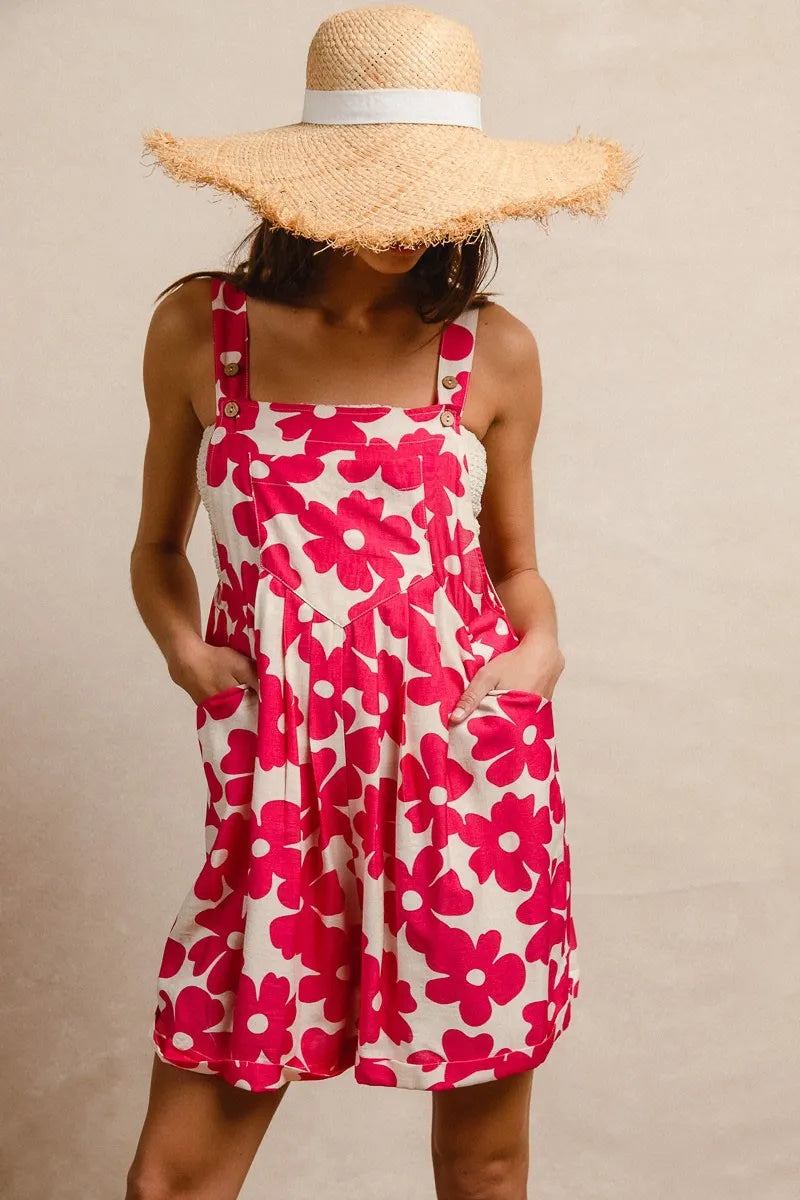 Floral print short overalls for women in pink and cream with adjustable straps and pockets