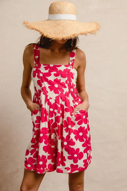 Floral print short overalls for women in pink and cream with adjustable straps and pockets