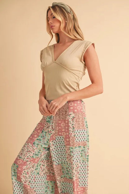 Boho wide leg pants in pastel colors featuring a floral patchwork design, perfect for casual chic outfits
