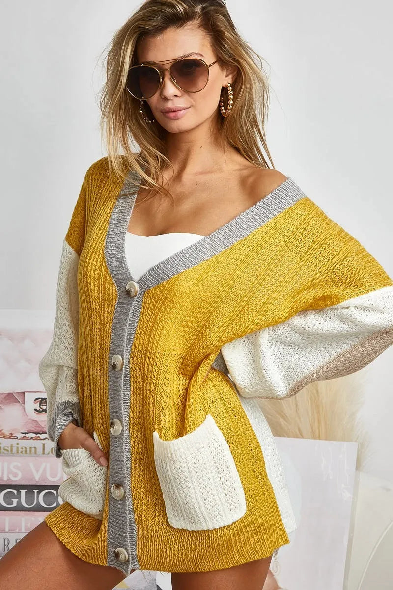 Trendy boho color block cardigan sweater in yellow and white with oversized fit and buttons