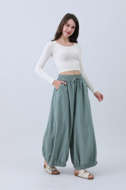 Leto Collection boho linen pants for women in soft green with a comfortable elastic waistband
