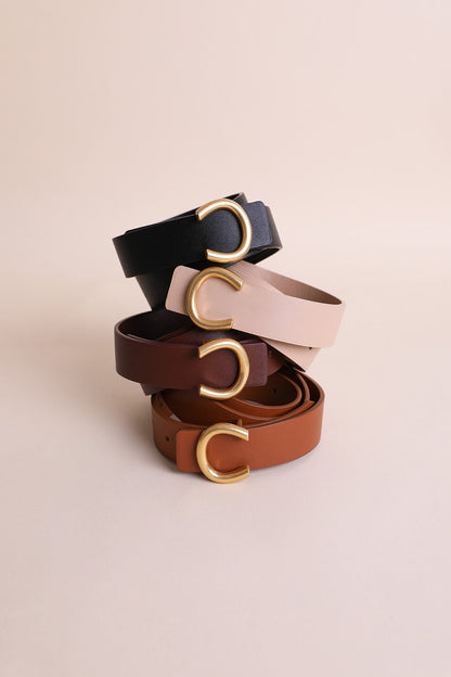 Four Leto Collection belts featuring a minimalist gold horseshoe belt buckle in various colors