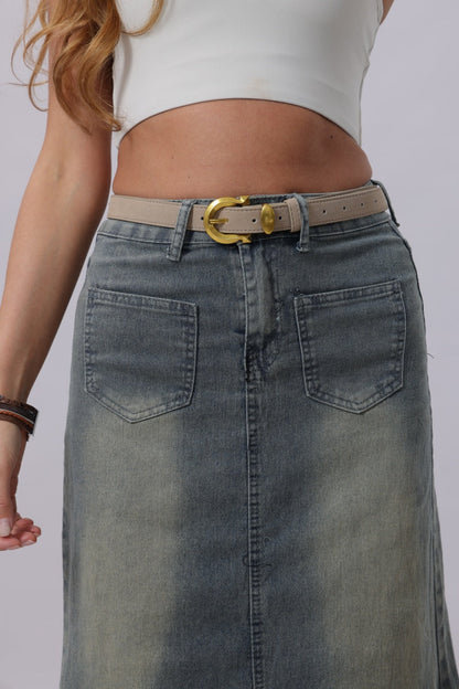 Boho suede belt for women styled with a denim skirt, featuring a gold-tone buckle for a fashionable look