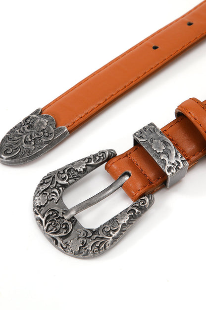 Antique floral western belt with a decorative silver buckle and contrasting brown leather strap