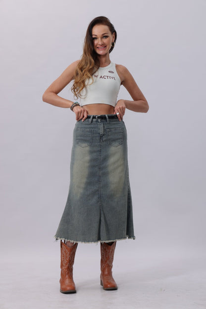 Stylish model wearing a denim skirt and floral embossed skinny leather belt for a trendy look