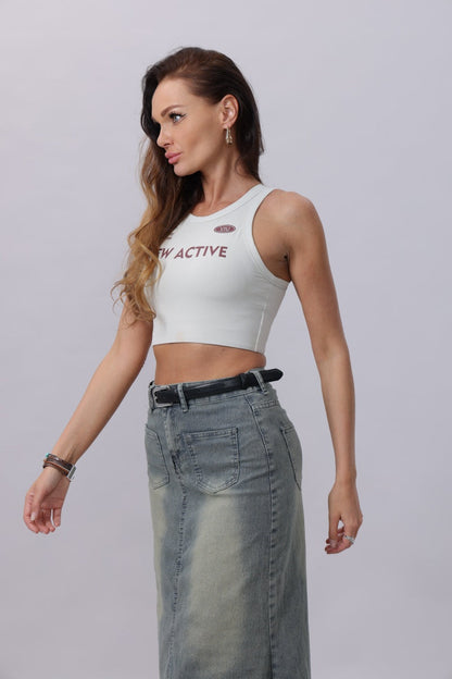 Model wearing a classic silver buckle belt women styled with a cropped top and a long denim skirt