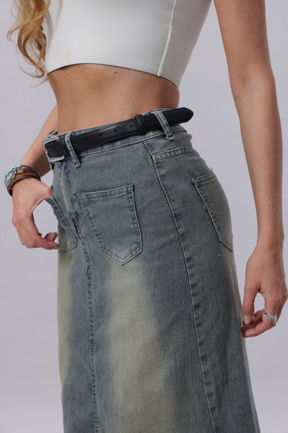 Model wearing a classic silver buckle belt women paired with a high-waisted denim skirt