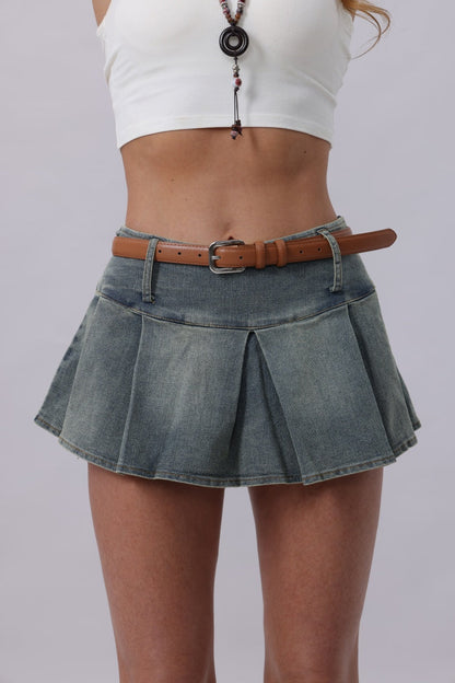 Classic silver buckle belt women styled with a denim pleated skirt for a trendy look