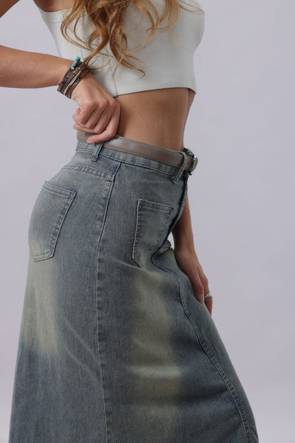 Fashionable woman wearing a classic silver buckle belt women with a denim skirt