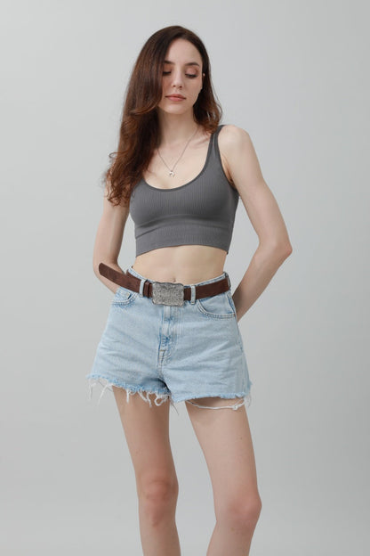 Leto Collection boho western buckle belt styled with denim shorts and a gray crop top