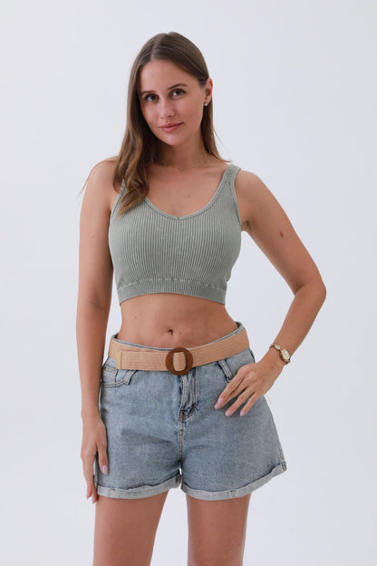 Model wearing a minimalist boho raffia belt over denim shorts for a stylish summer look