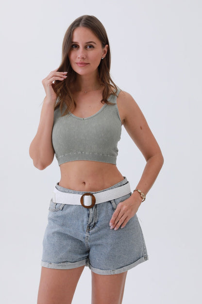 Minimalist boho raffia belt paired with a cropped top and denim shorts for a stylish look