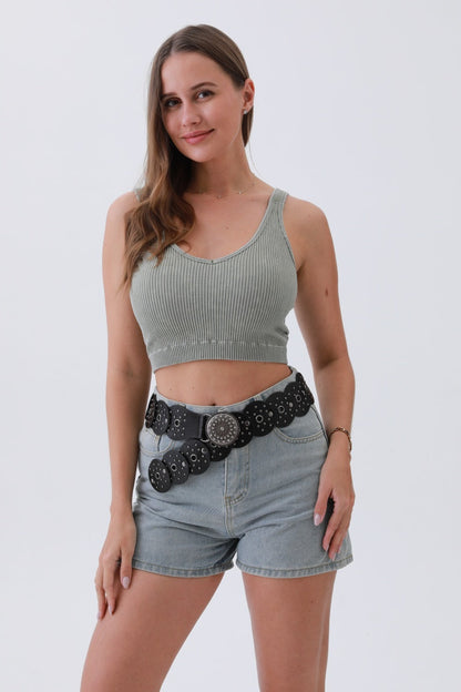 Edgy hollow-out belt from Leto Collection paired with a cropped top and denim shorts