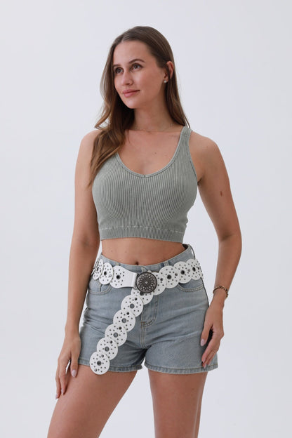 Leto Collection edgy hollow-out belt paired with a crop top and denim shorts for a trendy look