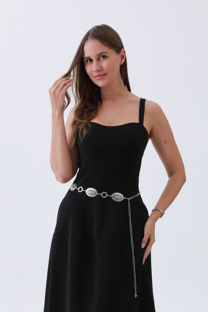 Leto Collection western chain link belt styled with a black dress for a chic look