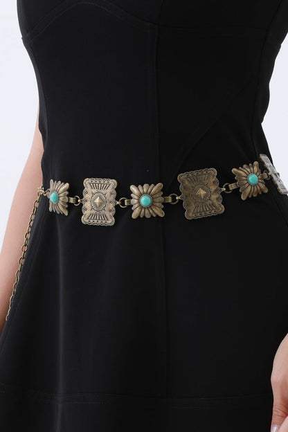 Turquoise western chain belt from Leto Collection featuring decorative floral designs and metal accents