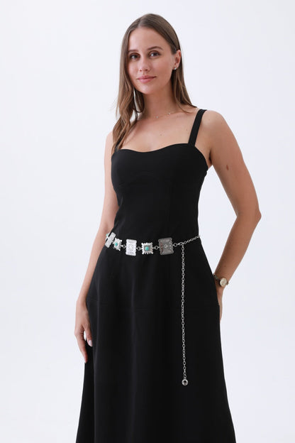 Turquoise western chain belt from Leto Collection styled on a model in a black dress