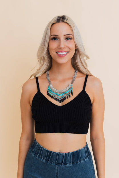 Stylish model wearing a Leto Collection Boho Necklace, showcasing Boho Chic Jewelry with spiritual elements