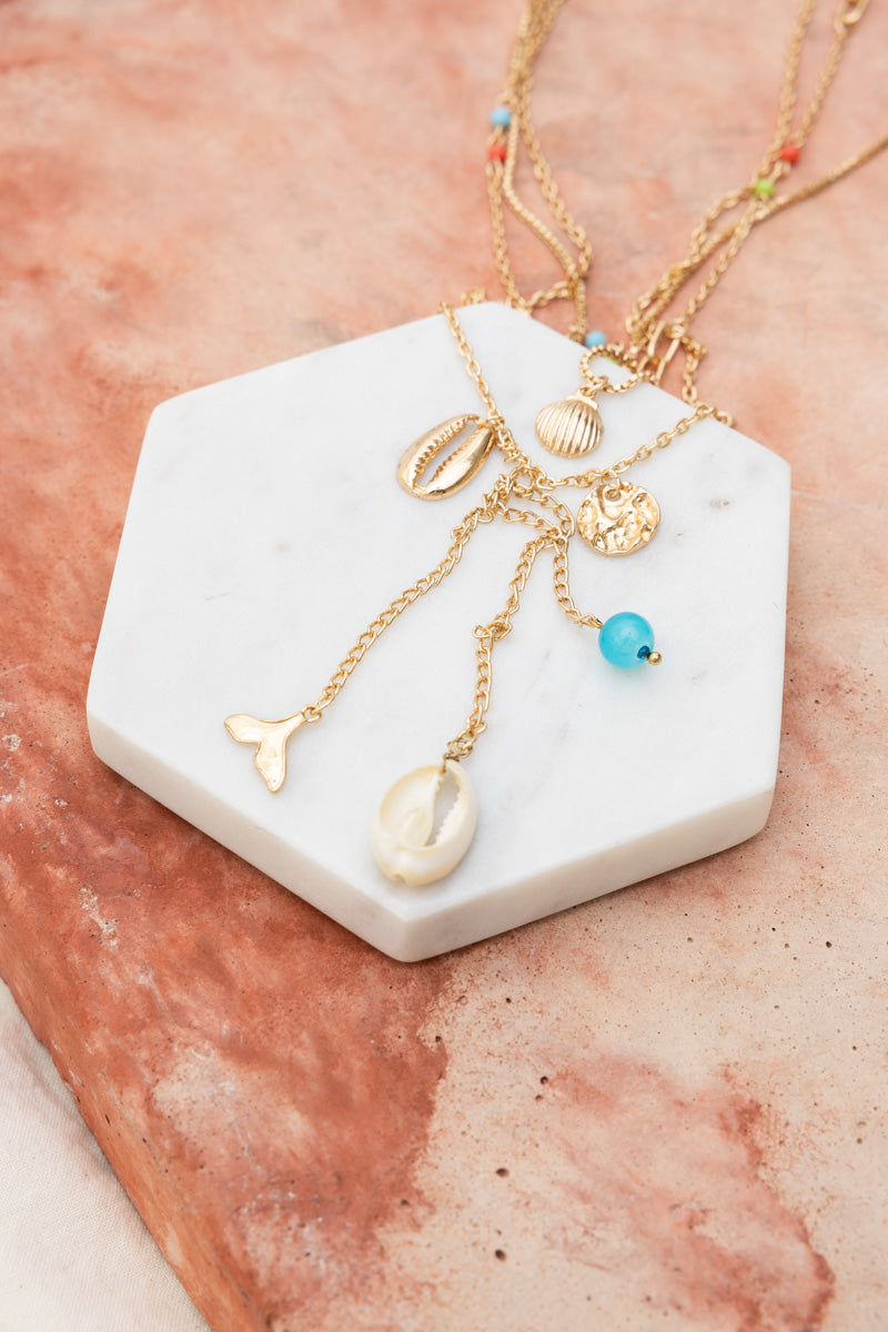 Leto Collection gold layered Boho Necklace, Boho Chic Jewelry, Spiritual shell and charm necklace with blue bead