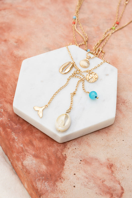 Leto Collection gold layered Boho Necklace, Boho Chic Jewelry, Spiritual shell and charm necklace with blue bead