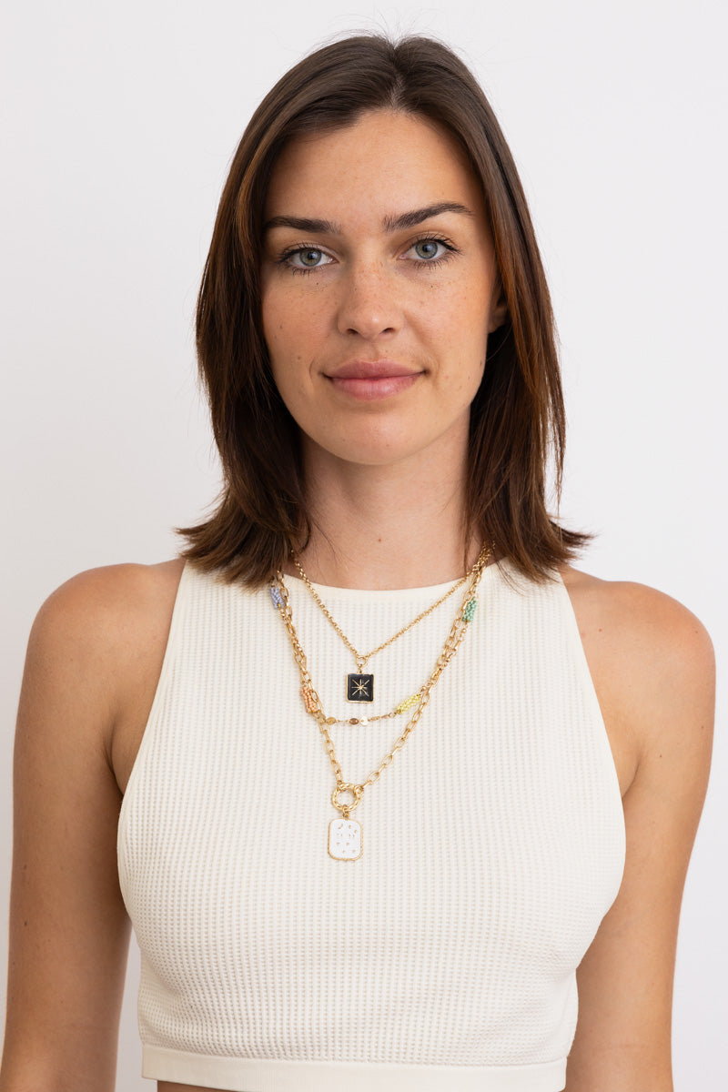 Leto Collection layered gold necklaces on model wearing white tank top Boho Necklace, Boho Chic Jewelry, Spiritual