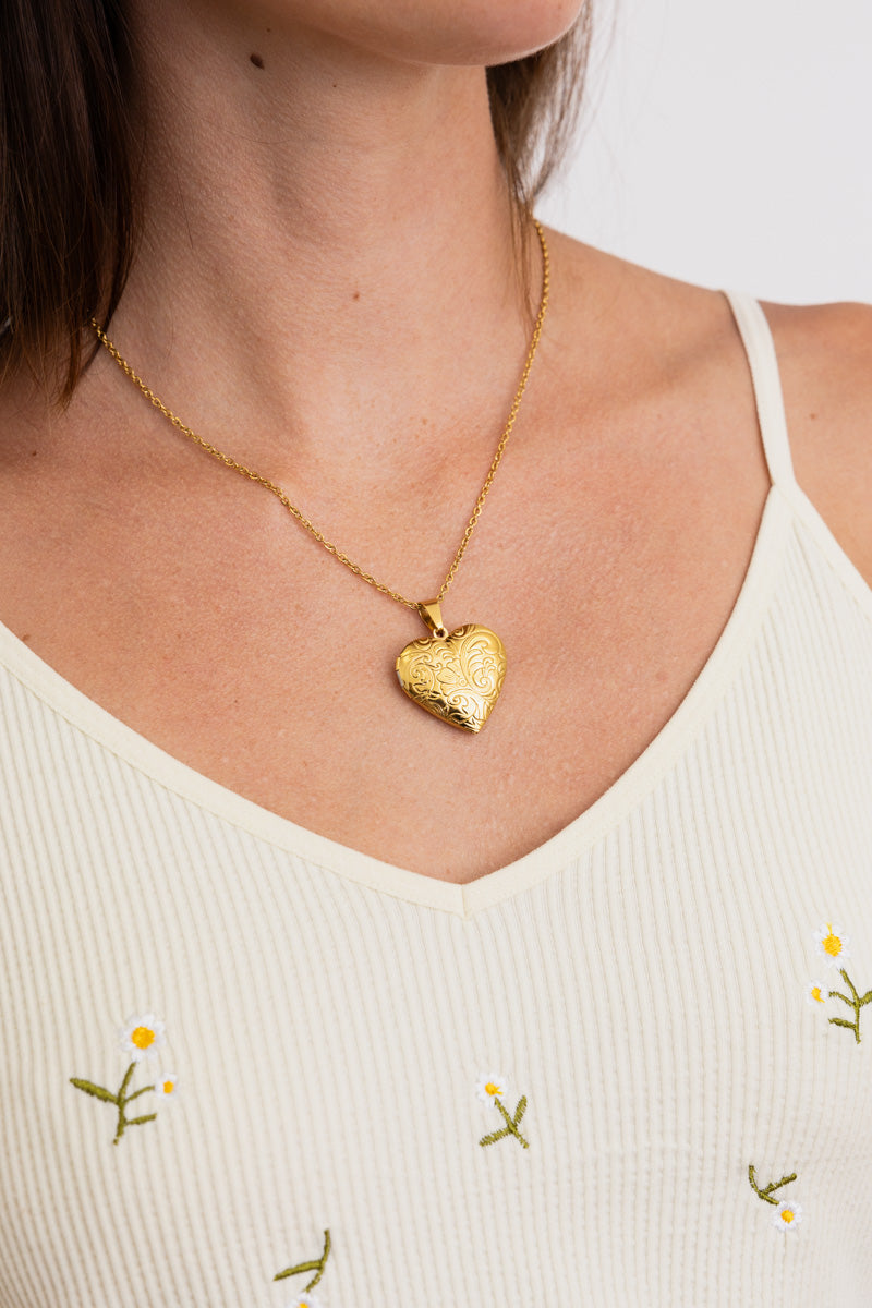 Boho Necklace, Boho Chic Jewelry, Spiritual gold heart locket pendant on model wearing cream top