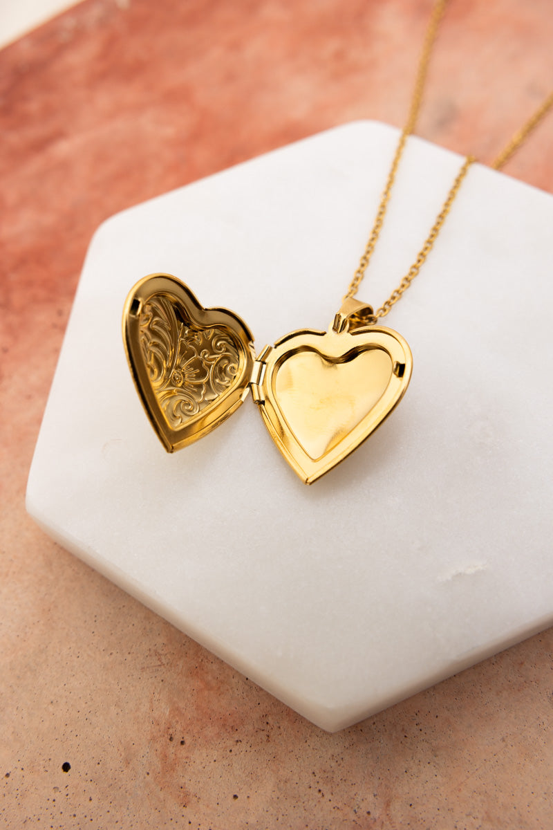 Gold heart locket necklace open on white marble tile with engraved interior detail Boho Necklace, Boho Chic Jewelry, Spiritual