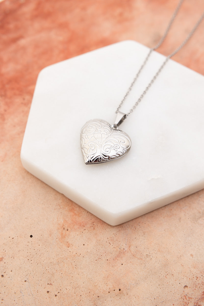 Silver engraved heart locket on fine chain on white marble slab Boho Necklace, Boho Chic Jewelry, Spiritual
