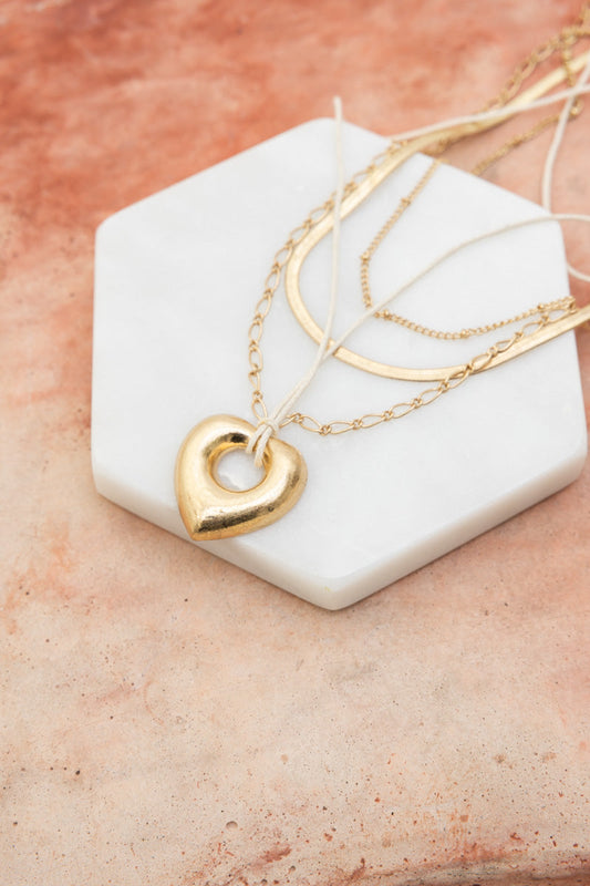 Leto Collection gold heart pendant on layered delicate chains on a marble tray Boho Necklace, Boho Chic Jewelry, Spiritual