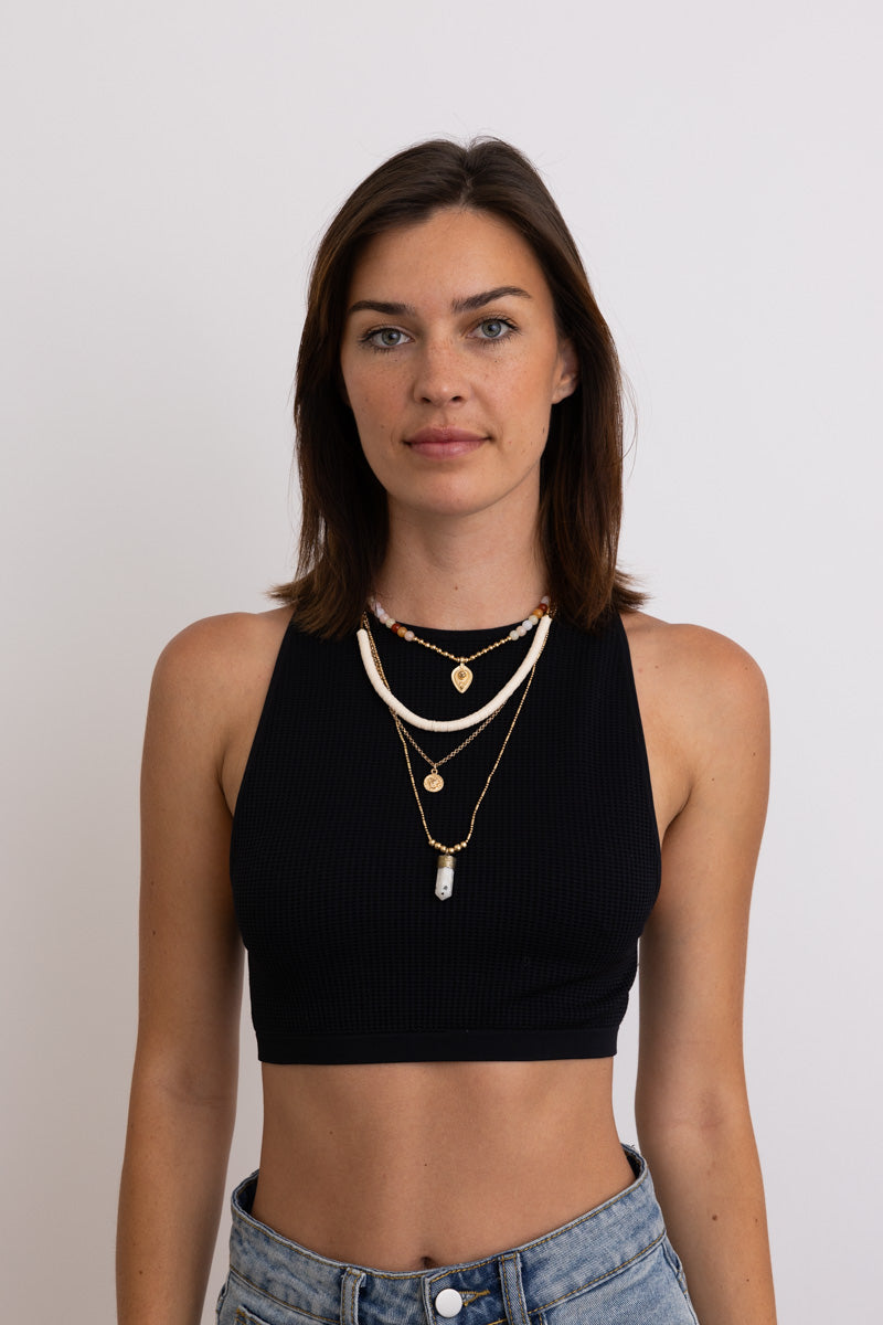 Leto Collection layered beach necklace on model wearing black crop top Boho Necklace, Boho Chic Jewelry, Spiritual
