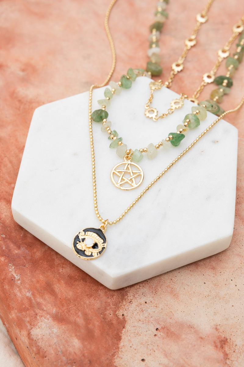 Leto Collection layered green aventurine and gold pendant necklaces on marble display Boho Necklace, Boho Chic Jewelry, Spiritual.