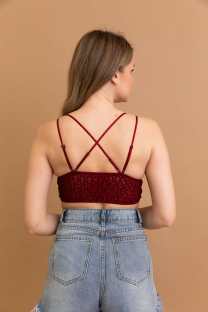 Back view of a Leto Collection boho crochet lace bralette in burgundy with adjustable straps