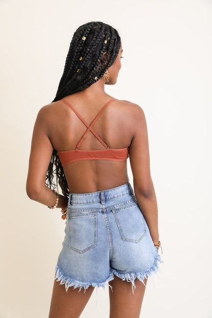 Leto Collection boho triangle bralette in rust color, featuring a stylish cross-back design