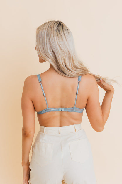 Back view of Leto Collection boho mesh bralette in light blue with adjustable straps