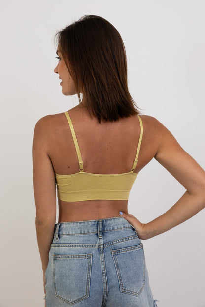 Back view of Leto Collection ribbed lace padded bralette in yellow with adjustable straps