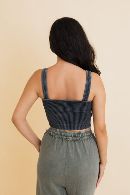 Back view of Leto Collection ribbed bralette for women in dark gray, paired with high-waisted pants