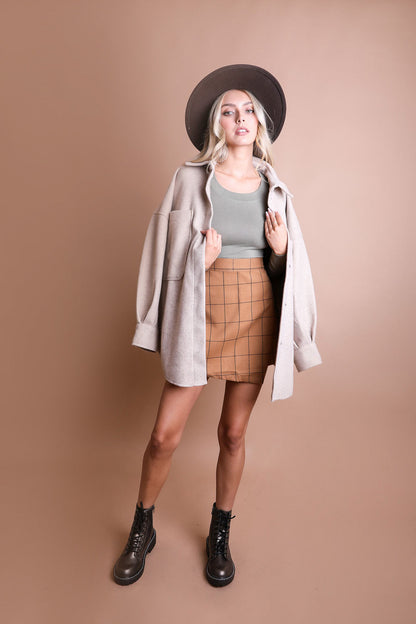 Leto Collection long sleeve fitted crop top in olive green, close-up view showing the soft fabric and sleek design.