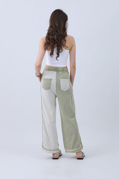 Back view of olive two-tone wide leg pants from Leto Collection with pocket details and comfortable fit