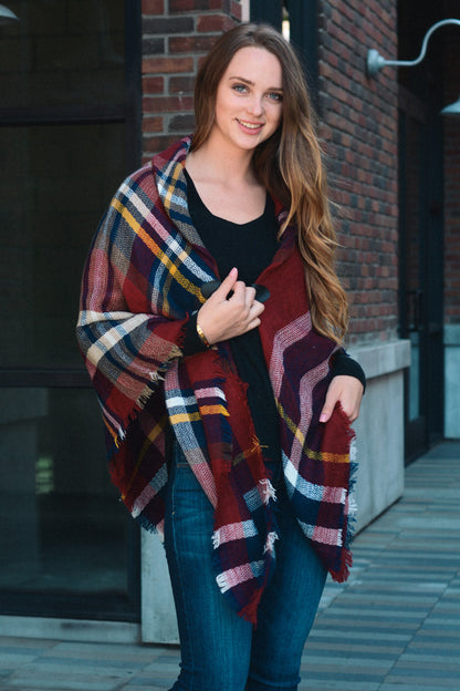 Leto Collection boho flannel poncho in burgundy and plaid pattern styled with a black top
