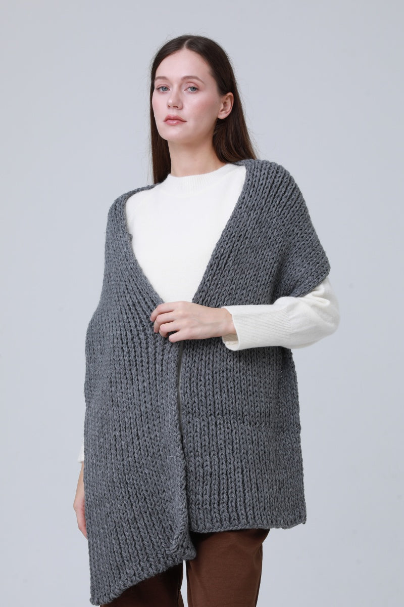 Chunky ribbed scarf for women in grey, styled as a cozy wrap over a white top.