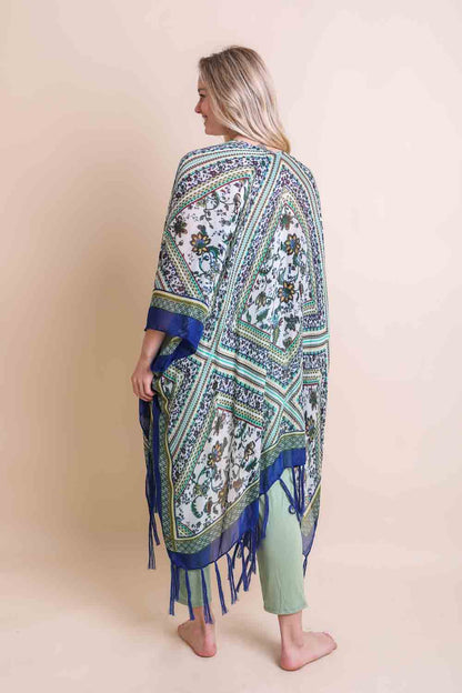 Blue bohemian diamond tassel kimono poncho by Leto Collection, featuring intricate patterns and flowing fabric.