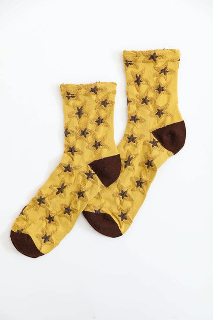 Leto Collection boho star socks in yellow with brown accents featuring star patterns