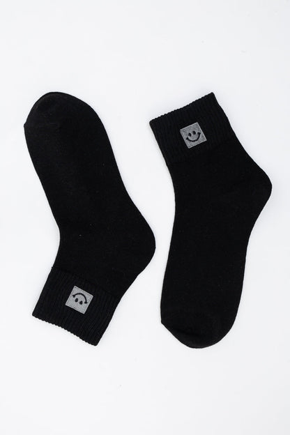 Leto Collection black smiley face socks with comfortable ribbed cuffs for casual wear