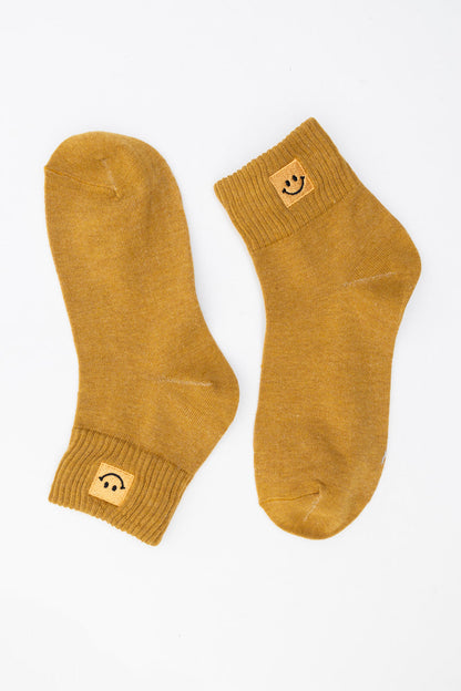 Leto Collection Smiley Face Socks in Mustard Yellow with Cozy Ribbed Cuff Design