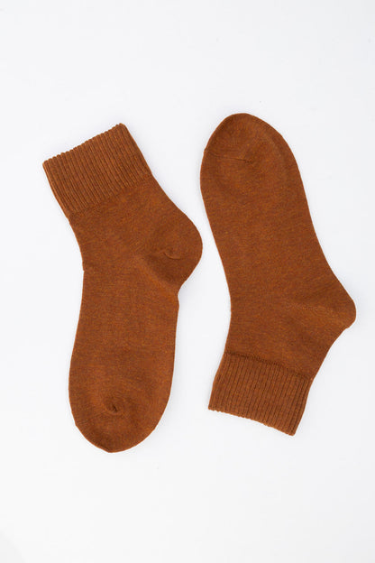 Cozy brown Leto Collection smiley face socks with a comfortable ribbed cuff